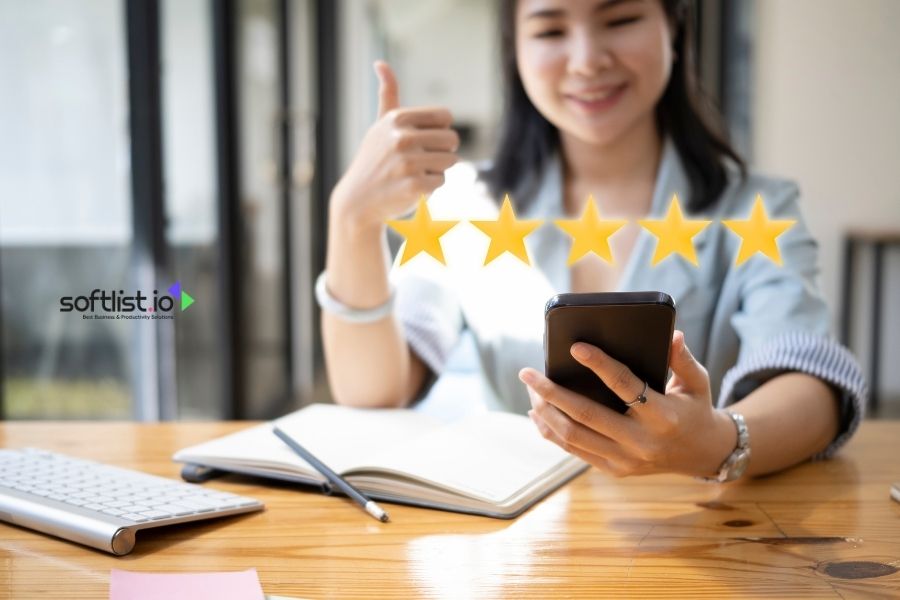 Smiling woman giving thumbs up with five-star rating.