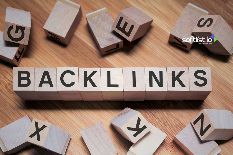 Wooden blocks spelling "Backlinks" scattered on a wooden surface.