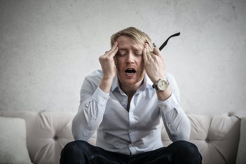 Free Photo Of Man Touching His Head Stock Photo