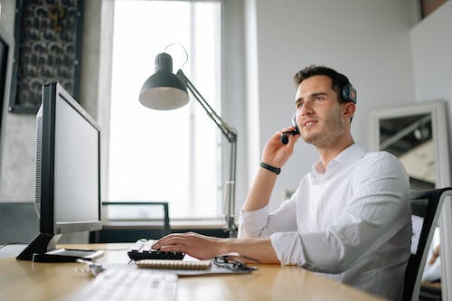 Free A Man Working in a Call Center Stock Photo