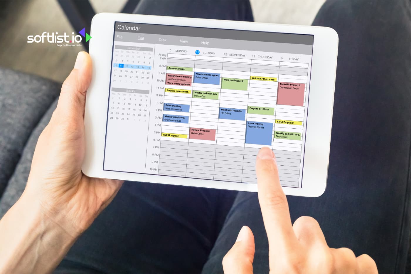 a person holding his laptop doing events planning