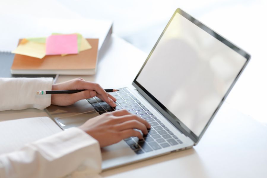 A person typing on a computer