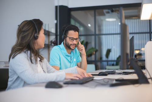 Free Man and Woman Working in the Office Stock Photo