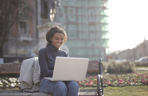 Free Photo Of Woman Using Laptop Stock Photo