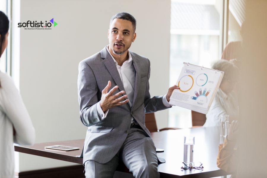 Businessman presenting sales data during a corporate meeting.