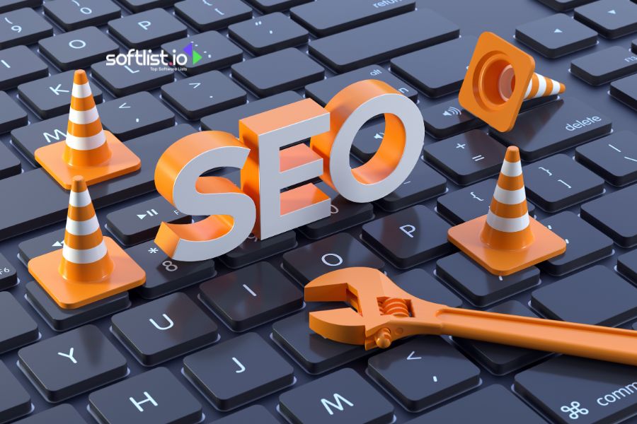 SEO concept with tools and traffic cones on a keyboard.