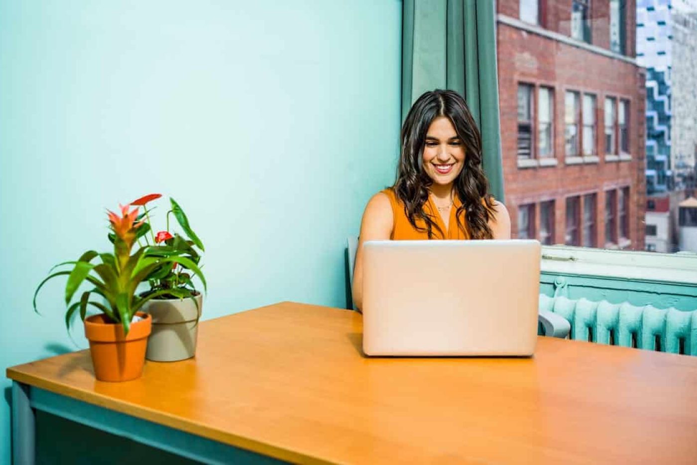 Girl using AI writer on laptop